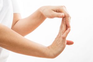 Image of a woman performing forearm exercises