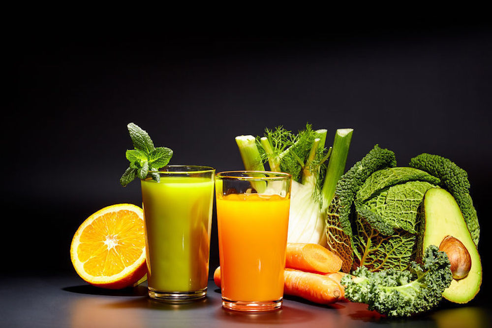 Image of fresh juice and food that provide a healthy liver