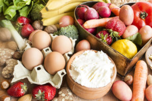 An image showing food that helps you to stay well